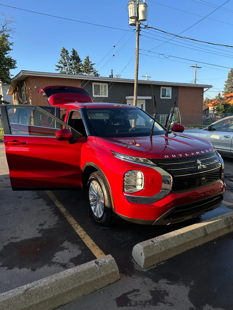 Detailed red Mitsubishi Outlander — Arc Detailing Calgary